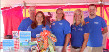 Larry Riley (R) joins Tammy Fanning, Traci Ousterhout, Sarah Draxler and Mike Astin at the 2014 Rock County 4-H fair.