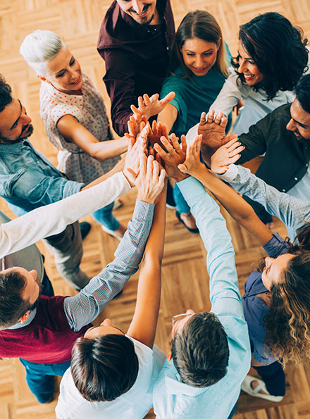 Work team doing a group high five