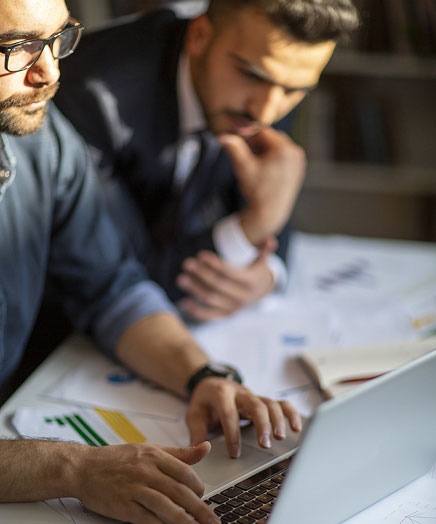 Two businessmen going over finances