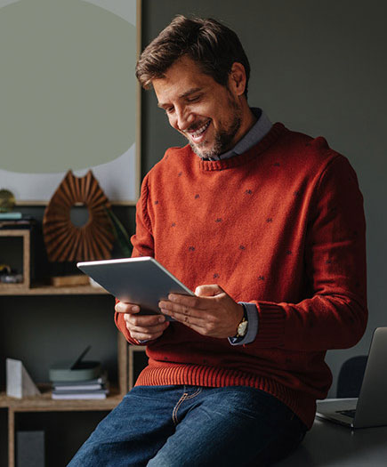 Man using tablet in home office