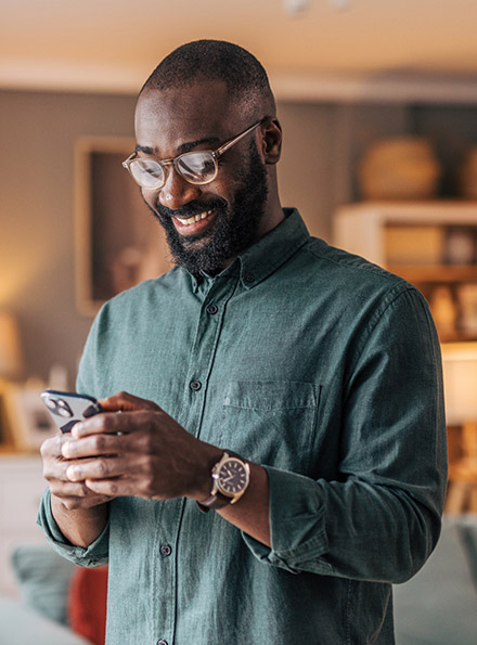 Man using phone in home office