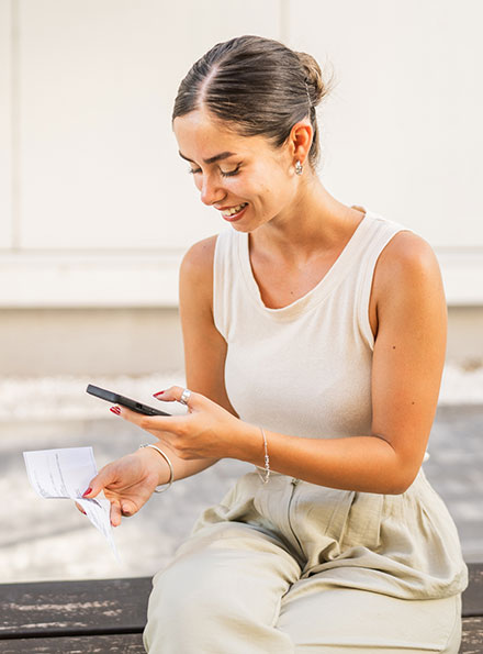 Woman depositing check with phone